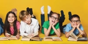 A row of kids reading books