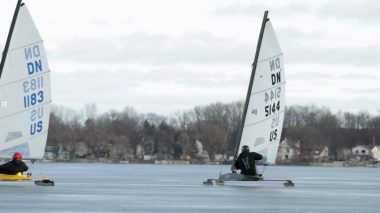 Two people using ice sailing boats