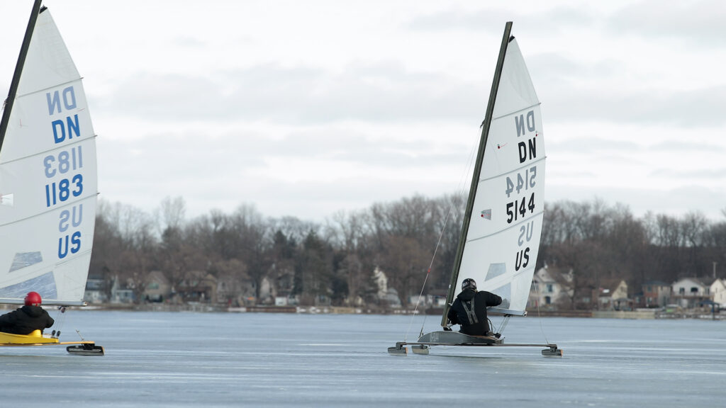 Two people using ice sailing boats