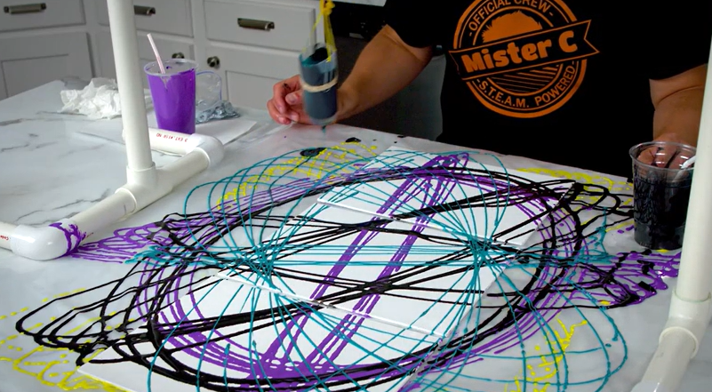 Mr. C's pendulum art. It is rings of black, purple, and blue