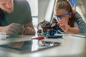 kid working on a robot