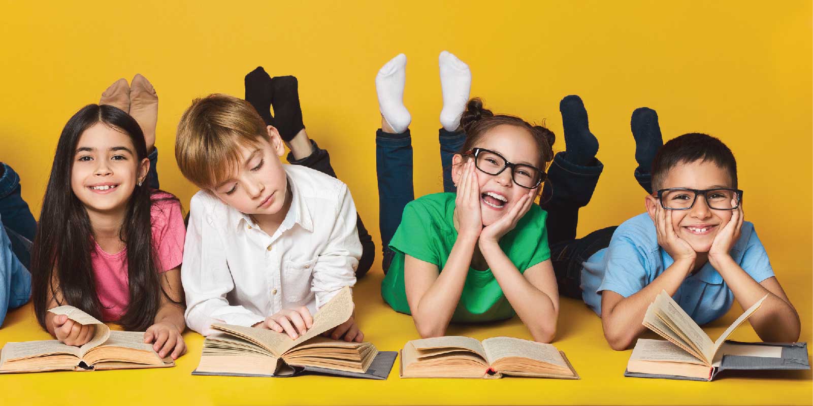 A row of kids reading books